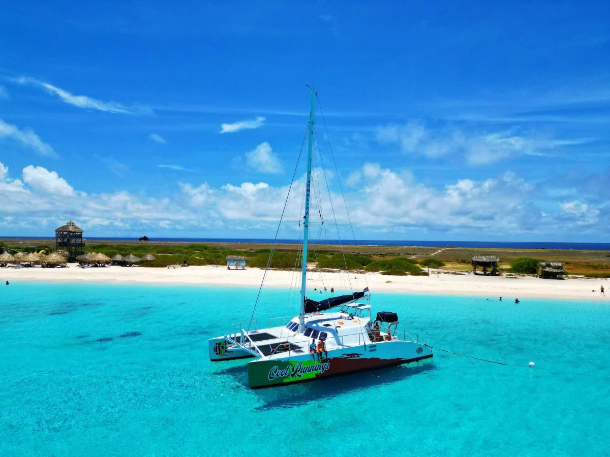 curacao-drone-catamaran-with-people-relaxing.webp